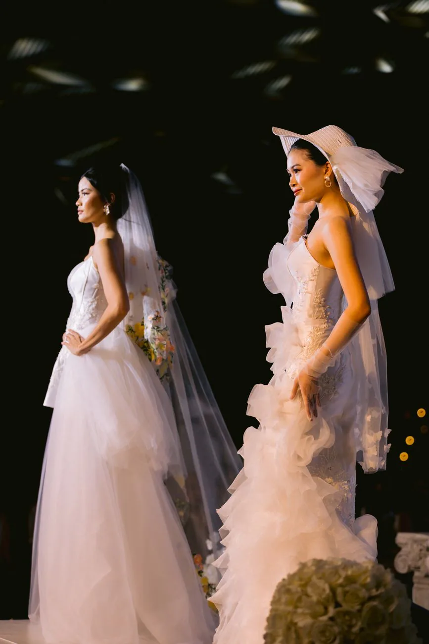 Models showcasing elegant bridal gowns on runway