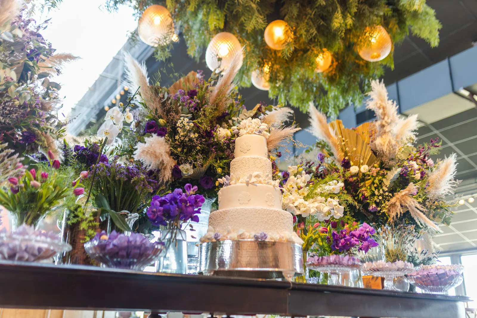 Stunning wedding reception setup with tiered cake